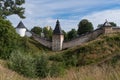 Tararygin tower, tower of the Upper Grids and Taylovskaya tower with fortress wall of Holy Dormition Pskovo-Pechersky Monastery. Royalty Free Stock Photo