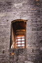 Tarascon castle granete inside, barred prison window Royalty Free Stock Photo