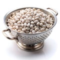 Tarbais beans placed in a colander, sitting on a white background Royalty Free Stock Photo