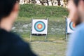 Target, archery coach or bow and arrow learning for archer competition, athlete challenge or girl training practice Royalty Free Stock Photo