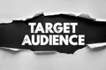 TARGET AUDIENCE message under torn paper concept representing marketing focus, customer segmentation, and communication strategy Royalty Free Stock Photo