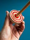 Target and business goal concepts. Word SUCCESS and big red target dart icon on round wooden was hit by wood arrow.