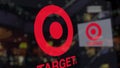 Target Corporation logo on the glass against blurred business center. Editorial 3D rendering