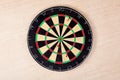 Target fail. Three arrows are not in the center of the darts on light wooden background, does not hit the aim. Concept for unsucce Royalty Free Stock Photo