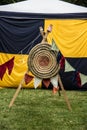 Target in front of a yellow black tent