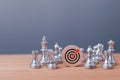 Target and goal expansion concept, Chess figures around dartboard and arrow for creative and set up business objective target goal