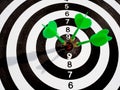 Target with three green dart focus on bull`s eye, Setting challenging business goals And ready to achieve the goal with teamwork