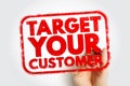 TARGET YOUR CUSTOMER bold stamp held by a hand, displaying strong textured wording within a rounded frame, expressing marketing Royalty Free Stock Photo