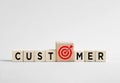 Targeting customer needs with marketing strategy using wooden cubes Royalty Free Stock Photo