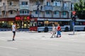 Targoviste, Romania - 2019. Pedestrians crossing the street using the crosswalk.