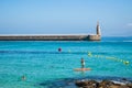 Tarifa SPAIN - 5 August 2022 - Men in recreational sports like paddle, diving and swimming in the Mediterranean sea Royalty Free Stock Photo