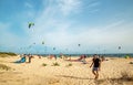 TARIFA, SPAINE - July 19, 2018: Beautiful white Tarifa beach packed with kitesurfers and sunbathers Royalty Free Stock Photo