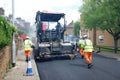 Tarmac road re-surfacing being carried out by Eurovia UK, a highways infrastructure and maintenance company.