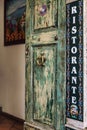 Tarmina, Italy, 08/30/2016: Old vintage entrance door to a restaurant