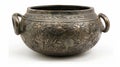 A tarnished bronze cauldron adorned with symbols of nature and animals used to prepare herbal brews for purification