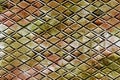 Tarnished green and copper metal with diamond patterned background Royalty Free Stock Photo