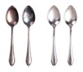 Tarnished and cleaned sterling silver spoons, isolated from above Royalty Free Stock Photo