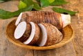 Taro root on wooden background