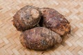Taro roots , bamboo basket. Royalty Free Stock Photo