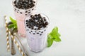 Taro and strawberry milk bubble tea in tall glasses