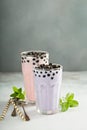 Taro and strawberry milk bubble tea in tall glasses