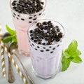 Taro and strawberry milk bubble tea in tall glasses