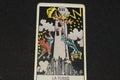 The tarot card number 16 represents THE TOWER in the tarot cards of the major arcana on a black background Royalty Free Stock Photo