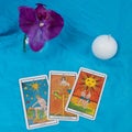 Tarot card, orchid and candle