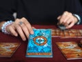 Tarot card reading wheel of fortune teller astrologer divination selected focus Royalty Free Stock Photo