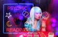 Tarot Card Readings Neon Sign in Window with Psychic Tarot Card Reader in background