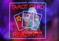 Tarot Card Readings Neon Sign in Window with Psychic Tarot Card Reader in background