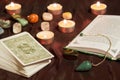 Tarot cards with book and pendulum