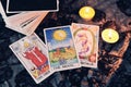 Tarot cards by candlelight on dark background fortune card prophecy gypsy card for fortune teller reading future Royalty Free Stock Photo