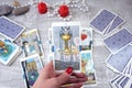 Tarot cards, candles and accessories on a wooden table Royalty Free Stock Photo