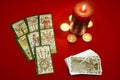 Tarot cards with candles on red textile Royalty Free Stock Photo
