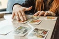 Tarot cards, Tarot card divination, esoteric background. A woman makes a layout on the cards at the table. Divination Royalty Free Stock Photo