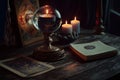 Tarot cards, crystal ball and burning candles on wooden table at night. Fortune telling and reading future. Astrology