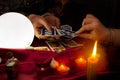 Tarot cards in hands of old gypsy fortune teller Royalty Free Stock Photo