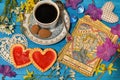 Tarot cards with love symbols, old cup and cookies on witch ritual table. Royalty Free Stock Photo