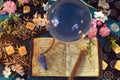 Tarot cards, magic ball and witch diary on ritual table. Royalty Free Stock Photo