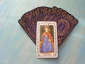 Tarot cards medieval close up with russian title The Empress Tarot Decks on blue wooden background Royalty Free Stock Photo