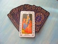 Tarot cards medieval close up with russian title The Hierophant Tarot Decks on blue wooden background