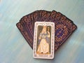 Tarot cards medieval close up with russian title The High Priestess Tarot Decks on blue wooden background Royalty Free Stock Photo