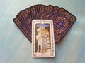 Tarot cards medieval close up with russian title The Tower Tarot Decks on blue wooden background Royalty Free Stock Photo
