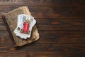 Tarot cards with old book on wooden table, top view. Space for text Royalty Free Stock Photo