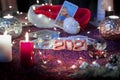 Tarot cards on table near burning candles. Tarot reader or Fortune teller reading on Christmas decoration