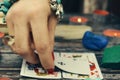 Tarot cards on the table. A woman fortune-teller predicts the future.