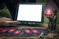 Tarot cards and tablet computer pad with blank screen with copy space. Fortune teller. Online divination.