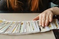 Tarot cards, Tarot card divination, esoteric background. A woman makes a layout on the cards at the table. Divination Royalty Free Stock Photo