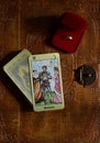 Tarot cards and a casket with a wedding ring on an old leather-bound book. Top view. Arkan lovers